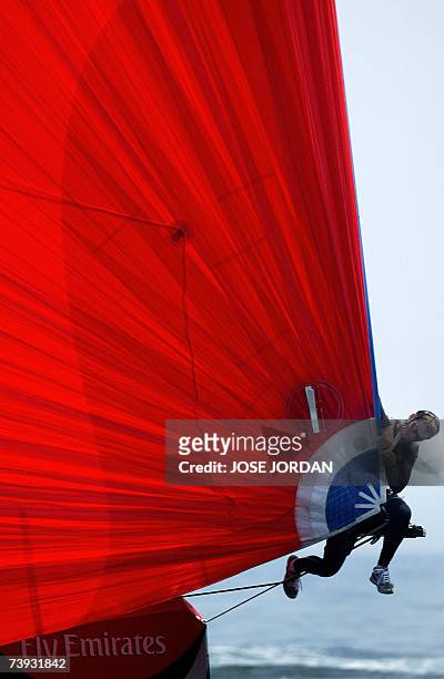 Member of the Emirates Team New Zealand repares the spinaker during the fifth day of the challenger selection series of the Louis Vuitton Cup in...