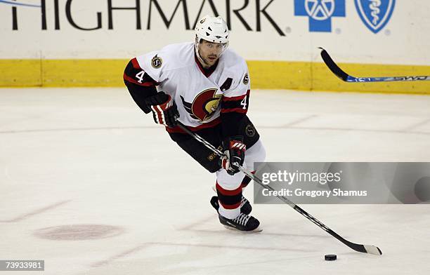 Chris Phillips of the Ottawa Senators skates with the puck against the Pittsburgh Penguins in game 4 of the Eastern Conference Quarterfinals during...