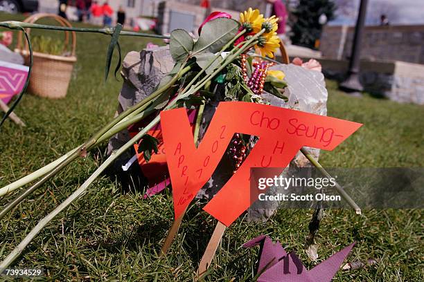 Stone to remember Cho Seung-Hui rests amongst the memorial to his 32 victims on campus of Virginia Tech University April 20, 2007 in Blacksburg,...