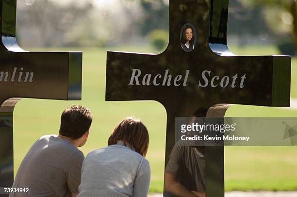 Roger Kovacs and his wife Lesli sit quietly in front of a memorial to Roger's friend Rachel Scott and other victims of the Columbine High School...