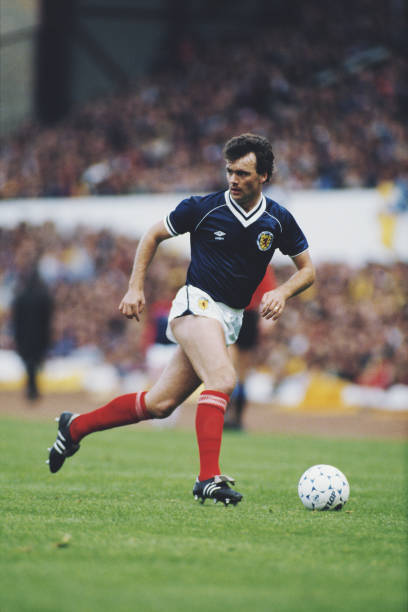 Scottish professional footballer Davie Cooper pictured in action playing for the Scotland national football team during an international game circa...