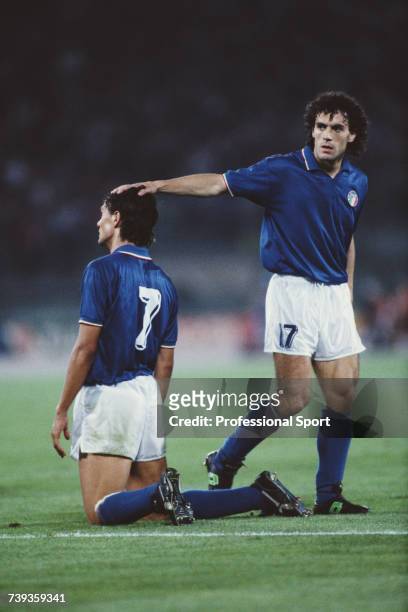 Italian footballer Roberto Donadoni places his hand on the head of team mate Paolo Maldini during the 1990 FIFA World Cup Group A match between Italy...