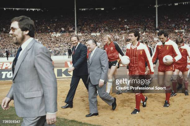 Managers Ron Atkinson and Bob Paisley lead players from their respective teams, Manchester United and Liverpool out on to the pitch prior to the...