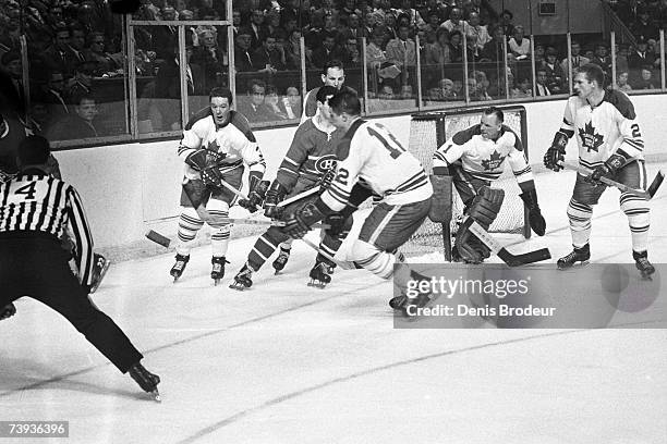 S: Goaltender Johnny Bower of the Toronto Maple Leafs defends the net against the Montreal Canadiens.