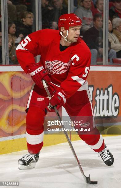 Nicklas Lidstrom of the Detroit Red Wings controls the puck against the Colorado Avalanche during their NHL game at Joe Louis Arena on January 28,...