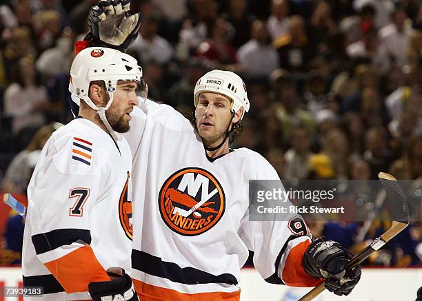 Ryan Smyth of the New York Islanders celebrates with Trent Hunter after scoring in the third period against the Buffalo Sabres during Game 5 of the...