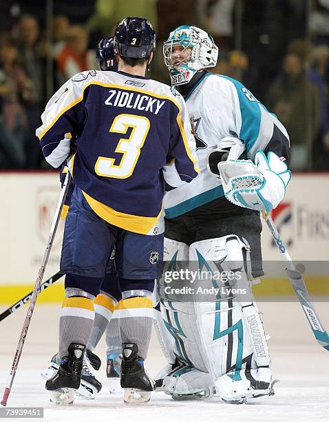 Evgeni Nabokov of the San Jose Sharks is congratulated by Marek Zidlicky of the Nashville Predators after the Sharks 3-2 win during Game 5 of the...