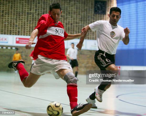 Daniel Saur of Heidenheim fights for the ball with Mojtabh Saifi ofd Hamburg during the Futsal Cup match between Team Heidenheim and SC Perisa...