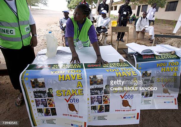 Nigeria's INEC officials set up their equipement prior to the start of the first round of President election in Abeokuta 21 April 2007. Voting began...
