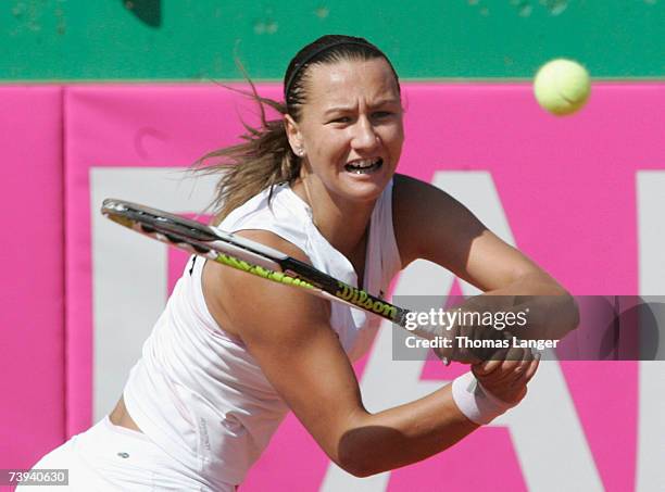 Ivana Lisjak of Croatia plays a backhand in her match against Anna-Lena Groenefeld of Germany during the Fed Cup game between Germany and Croatia on...