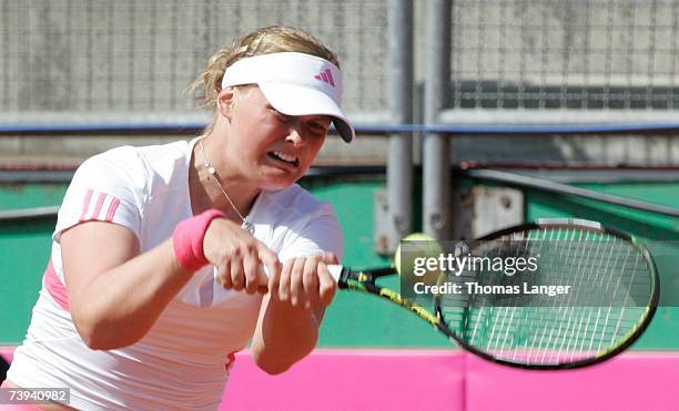 Anna-Lena Groenefeld of Germany plays a backhand in her match against Ivana Lisjak of Croatia during the Fed Cup game between Germany and Croatia on...
