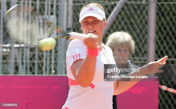 Anna-Lena Groenefeld of Germany plays a backhand in her match against Ivana Lisjak of Croatia during the Fed Cup game between Germany and Croatia on...