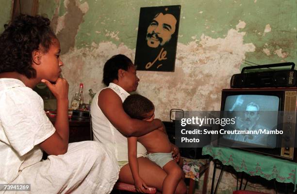 Cuban family in Old Havana watches a Fidel Castro speech on television October 8, 1997 in Havana, Cuba.