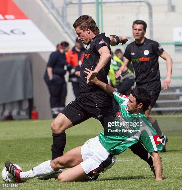 Marvin Braun of St. Pauli vies for the ball with Dennis Puhl of Gladbach during the Third League match between Borussia Monchengladbach II and FC St....