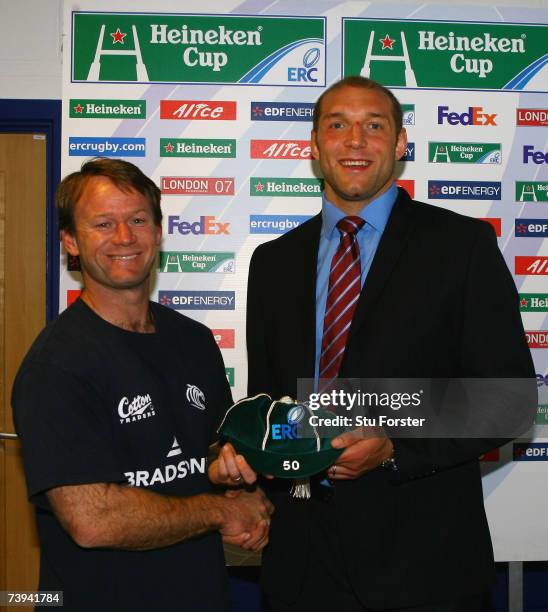 Ben Kay of Leicester receives his 50th Heineken Cup cap from his coach, Pat Howard following the Heineken Cup Semi Final match between Leicester...