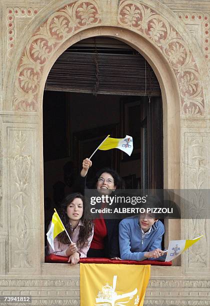 Group of faithful salutes Pope Benedict XVI as he arrives at Ducal square to preside over the mass in Vigevano northern Italy 21 April 2007. The...