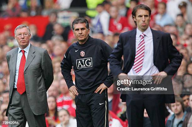 Manchester United Manager Sir Alex Ferguson, his Assistant Carlos Queiroz and Middlesbrough Manager Gareth Southgate watch the action from the...