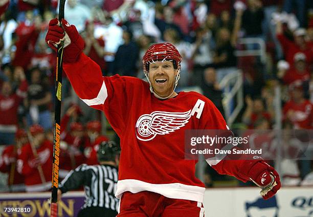 Kris Draper of the Detroit Red Wings celebrates teammate Chris Chelios' goal scored against the Calgary Flames during game 5 of their 2007 NHL...