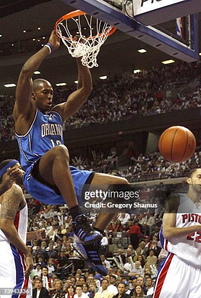 Dwight Howard of the Orlando Magic dunks in front of Tayshaun Prince and Rasheed Wallace of the Detroit Pistons in game one of the Eastern Conference...