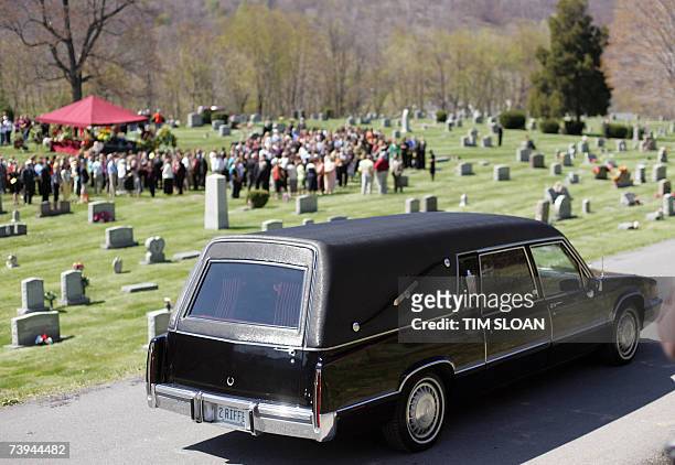 Narrows, UNITED STATES: The hearse carrying Jarrett Lee Lane, one of 32 shooting victims of the Virginia Tech University massacre, arrives at the...