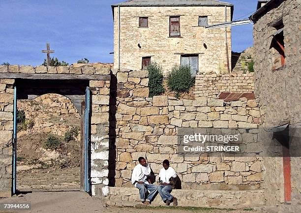 Par Peter MARTELL: Picture taken 24 February 2007 shows young Eritrean monks busk in the dawn sunshine after an all-night vigil at the remote...