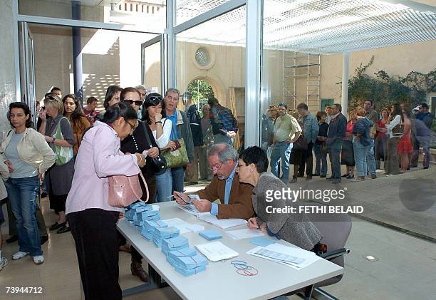 French citizens line up to vote in the presidential election 22 April 2007 at the French general consulate in Tunis. Some 44.5 million eligible...