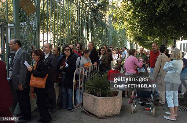 French citizens line up at the entrance of the French consulate in Tunis, 22 April 2007, to vote for the French presidential election. Voting started...