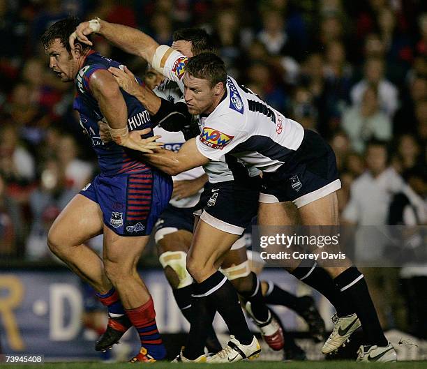 Josh Perry of the Knights breaks through the Broncos defence during the round six NRL match between the Newcastle Knights and the Brisbane Broncos at...