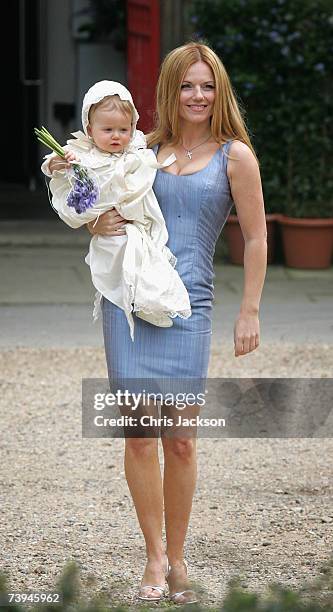 Singer Geri Halliwell poses with her daughter Bluebell Madonna as they arrive for Bluebell's christening at St. Michael's church in Highgate on April...