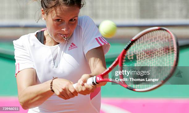 Tatjana Malek of Germany plays a backhand during game against Ivana Lisjak during the Fed Cup game between Germany and Croatia on April 22, 2007 in...