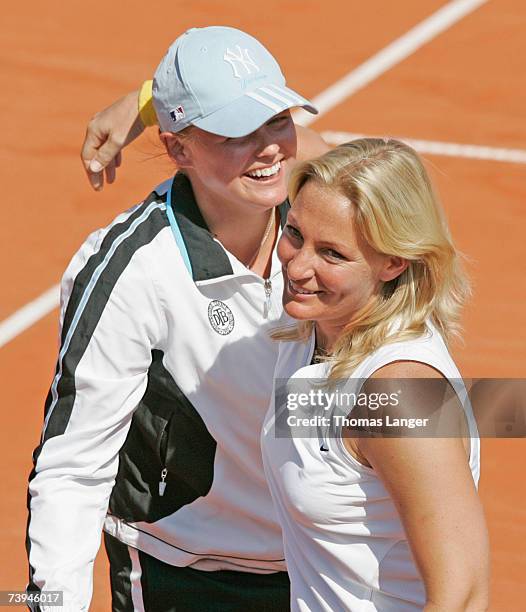 Team captain Barbara Rittner and Anna-Lena Groenefeld of Germany celebrate after Tatjana Malek's game against Ivana Lisjak during the Fed Cup game...