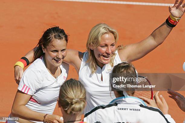Tatjana Malek and team captain Barbara Rittner of Germany celebrate after Malek's game against Ivana Lisjak during the Fed Cup game between Germany...