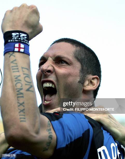 Inter Milan's defender Marco Materazzi jubilates with team-mates after scoring a penalty against Siena during their Italian serie A football match at...