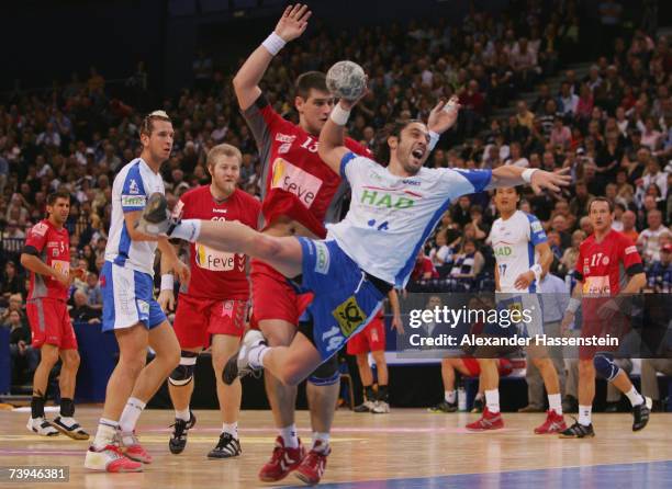 Bertrand Gille of Hamburg in action with Julen Aginagalde of Leon during the European Cup Winners Cup Final HSV Handball v Ademar Leon at the Color...