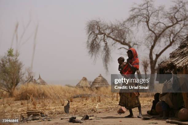 Chadian woman and her children seen in the abandoned Aramgo village that was attacked by Janjawid southwest of Goz Beida April 22, 2007 in Chad....