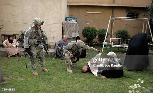 Army Specialist Dylon Chambers from San Antonio, Texas and Staff Sergeant Mike Wilson from Rochester, New Hampshire of the D-CO 2/325 AIR 82nd...