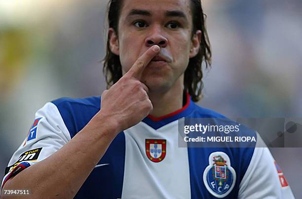 Porto's Brazilian Adriano Louzada celebrates after scoring against Belenenses during their Portuguese Super League football match at the Dragao...