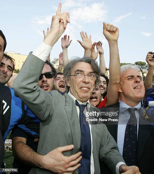 Massimo Moratti, owner and president of Inter Milan, celebrates with players and supporters after his team win the Italian Serie A football match...