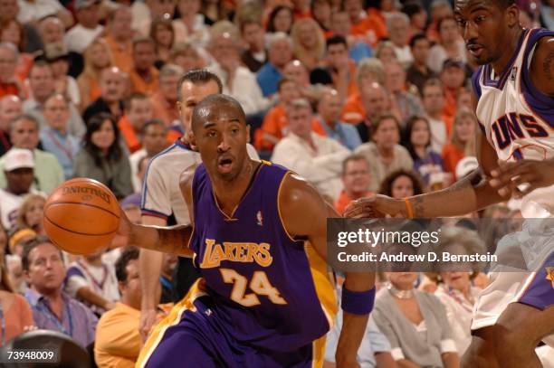 Kobe Bryant of the Los Angeles Lakers drives against Amare Stoudemire of the Phoenix Suns in Game One of the Western Conference Quarterfinals during...