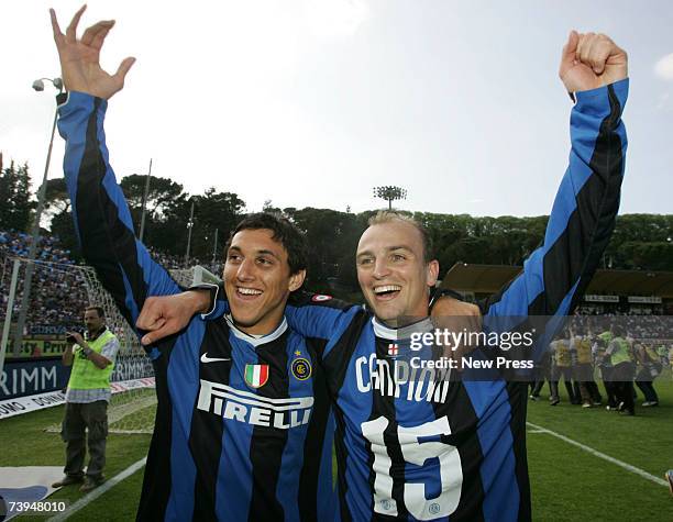 Nicolas Burdisso and Esteban Cambiasso of Inter Milan celebrate after the Italian Serie A football match between AC Siena and FC Inter Milan at the...