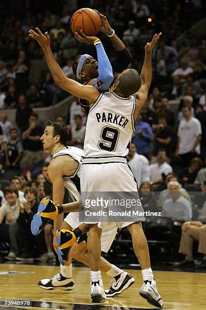 Guard Allen Iverson of the Denver Nuggets takes a shot against Tony Parker of the San Antonio Spurs in Game One of the Western Conference...