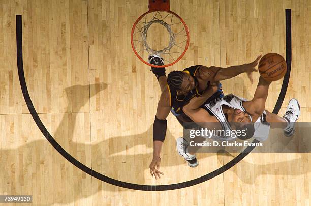 Robert Horry of the San Antonio Spurs shoots against Nene of the Denver Nuggets in Game One of the Western Conference Quarterfinals during the 2007...