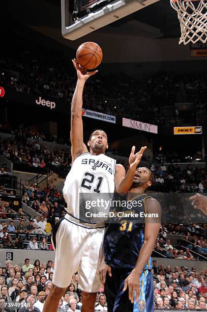 Tim Duncan of the San Antonio Spurs shoots against Nene of the Denver Nuggets in Game One of the Western Conference Quarterfinals during the 2007 NBA...