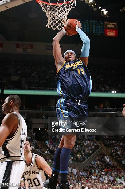 Carmelo Anthony of the Denver Nuggets goes to the basket against the San Antonio Spurs in Game One of the Western Conference Quarterfinals during the...