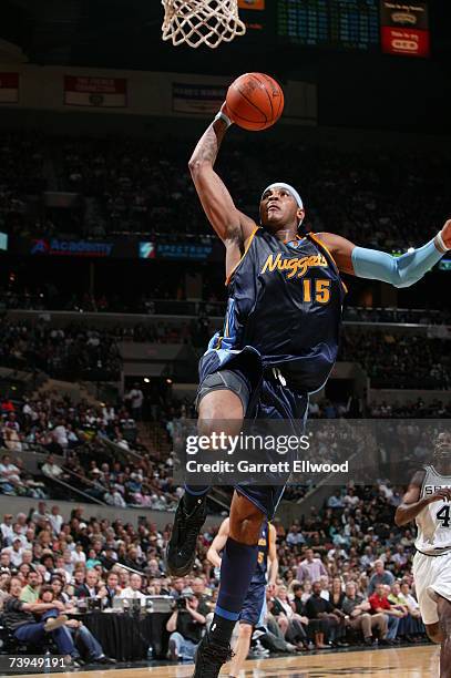 Carmelo Anthony of the Denver Nuggets goes to the basket against the San Antonio Spurs in Game One of the Western Conference Quarterfinals during the...