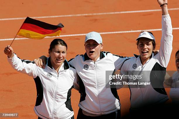 Sandra Kloesels, Anna-Lena Groenefeld and Andrea Petkovic of Germany celebrate after Tatjana Malek?s game against Ivana Lisjak during the Fed Cup...