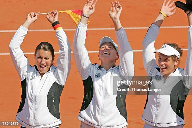 Sandra Kloesels, Anna-Lena Groenefeld and Andrea Petkovic of Germany celebrate after Tatjana Malek?s game against Ivana Lisjak during the Fed Cup...