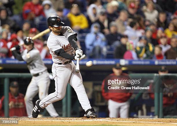 Center fielder Chris Burke of the Houston Astros hits a grand slam during the game against the Philadelphia Phillies on April 13, 2007 at Citizens...
