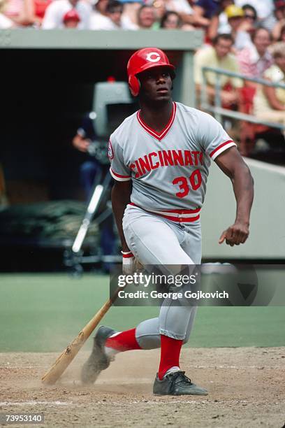 Outfielder Ken Griffey, Sr. #30 of the Cincinnati Reds bats against the Pittsburgh Pirates at Three Rivers Stadium in July 1976 in Pittsburgh,...