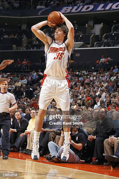 Adam Morrison of the Charlotte Bobcats takes a jump shot against the Cleveland Cavaliers at Charlotte Bobcats Arena on March 20, 2007 in Charlotte,...